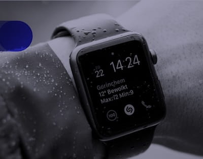 Grey-scale photo of an apple watch on a man’s wrist